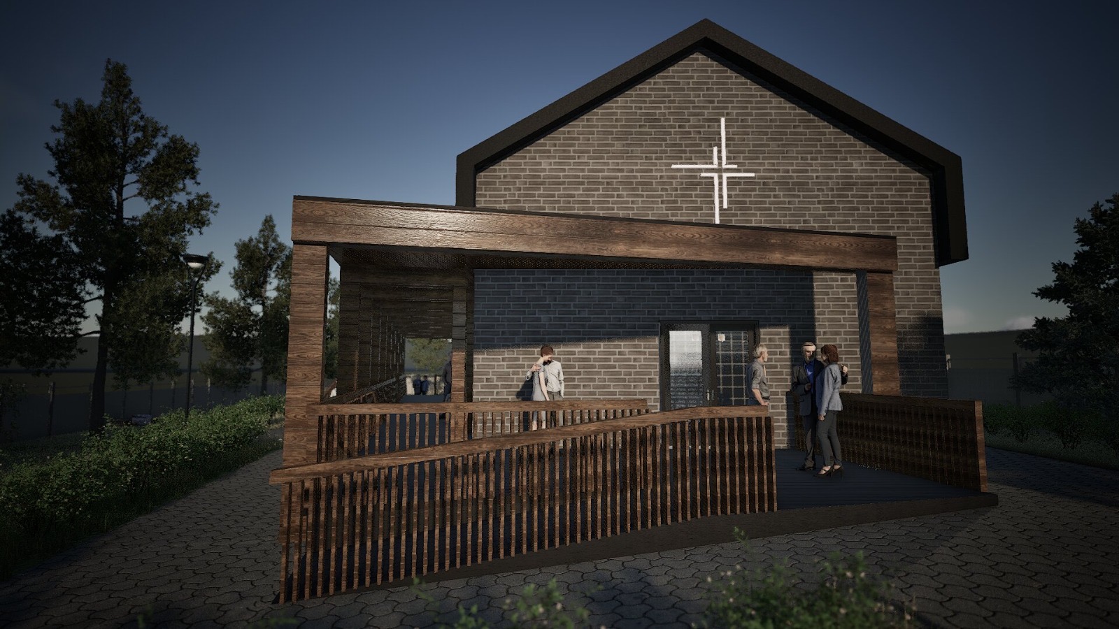 Capela funerară seara, fațadă din cărămidă cu cruce iluminată și terasă din lemn